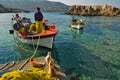 Cats and fshermen on the pier of Lefkos, Karpathos island